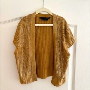 BCBG Maxazria gold shimmer shrug. Size small.